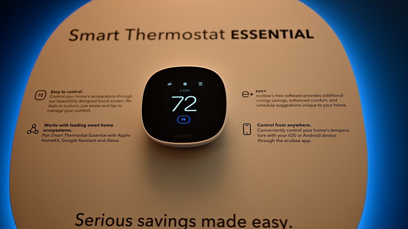 Smart thermostat on display showing temperature. Surrounding text highlights features like easy control, compatibility with smart home systems, and remote access via app. Soft blue lighting enhances presentation.