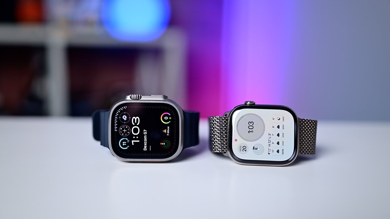 Two smartwatches on a white table displaying digital time against a blurred purple and blue background.