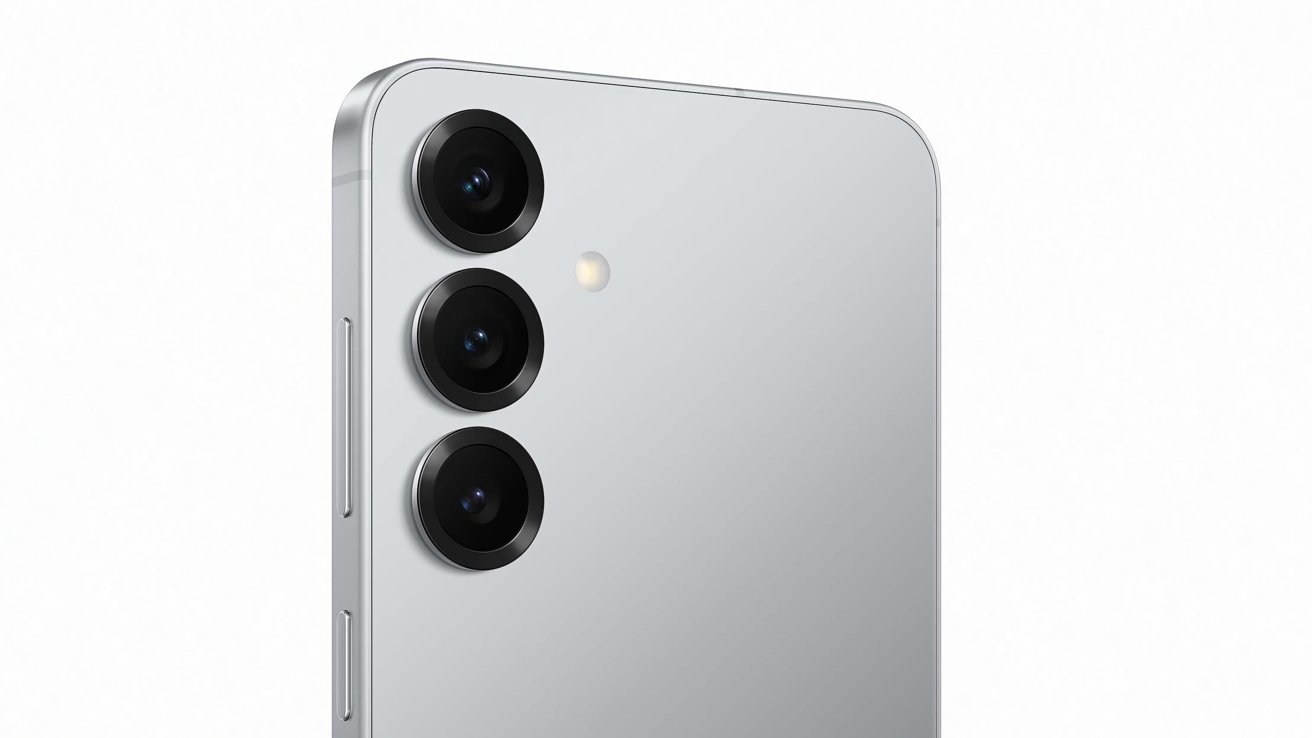 Silver smartphone back with three vertically aligned camera lenses and a small flash on a white background.