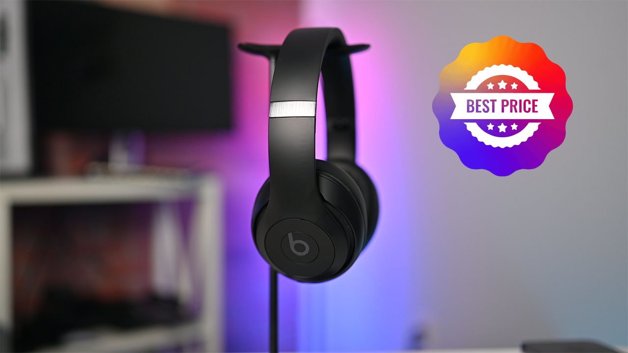 Black Beats Studio Pro headphones on a stand with a colorful badge displaying 'Best Price' in the background.