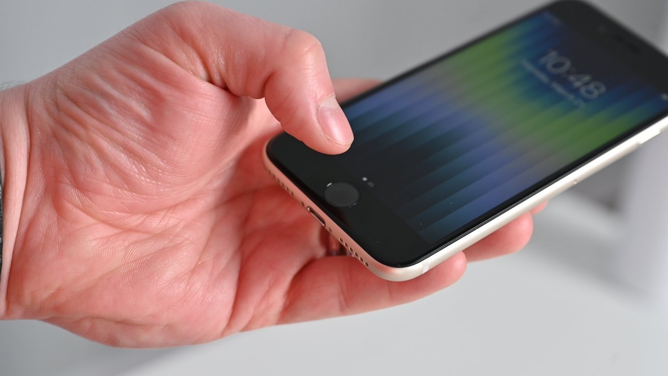 A hand holding a smartphone displaying a colorful striped wallpaper and the time 10:48 AM.