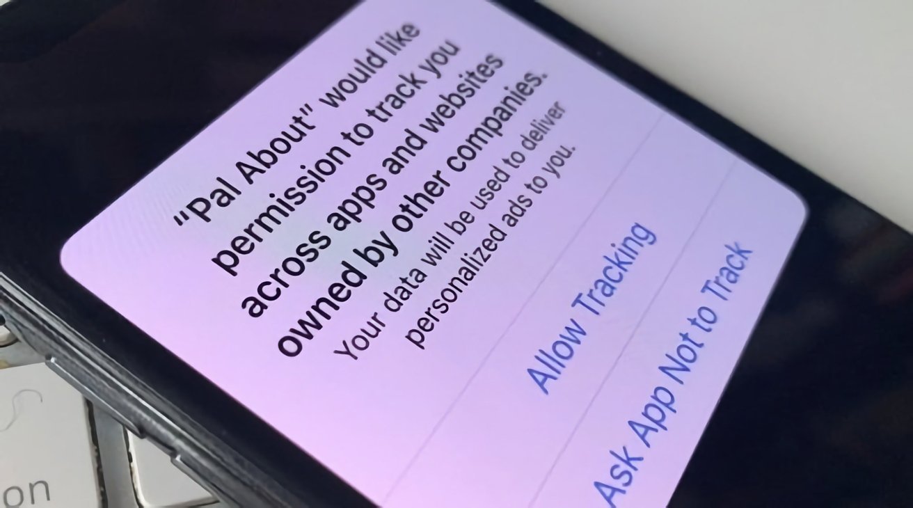 Smartphone screen showing tracking permission request with options to allow or deny tracking across apps and websites.