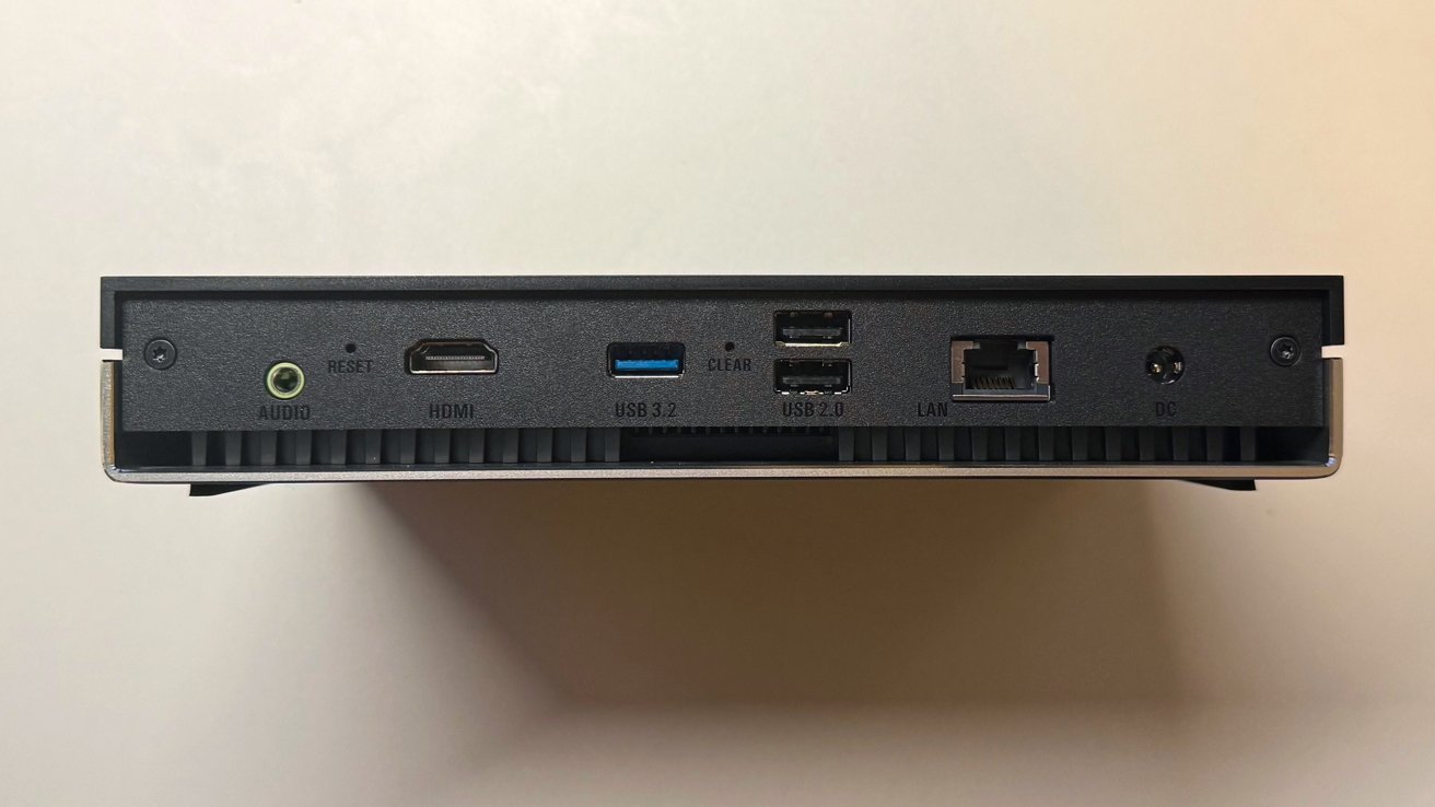 Panel belakang perangkat dengan audio, HDMI, USB 3.2, dua port USB 2.0, LAN, dan DC, dan tombol reset.