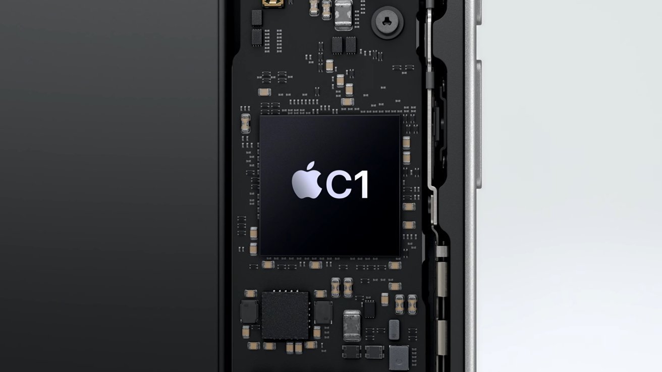 Close-up papan sirkuit internal smartphone yang menampilkan microchip besar berlabel dengan logo Apple dan C1, dikelilingi oleh komponen elektronik yang lebih kecil.