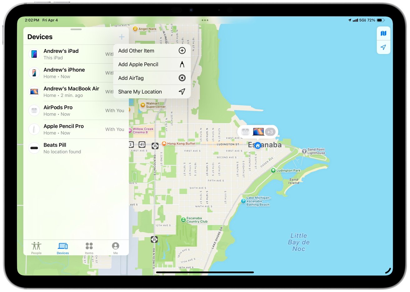 iPad showing a map of Escanaba with a list of Apple devices, including iPad, iPhone, MacBook Air, AirPods Pro, and Apple Pencil. Options to add items nearby.