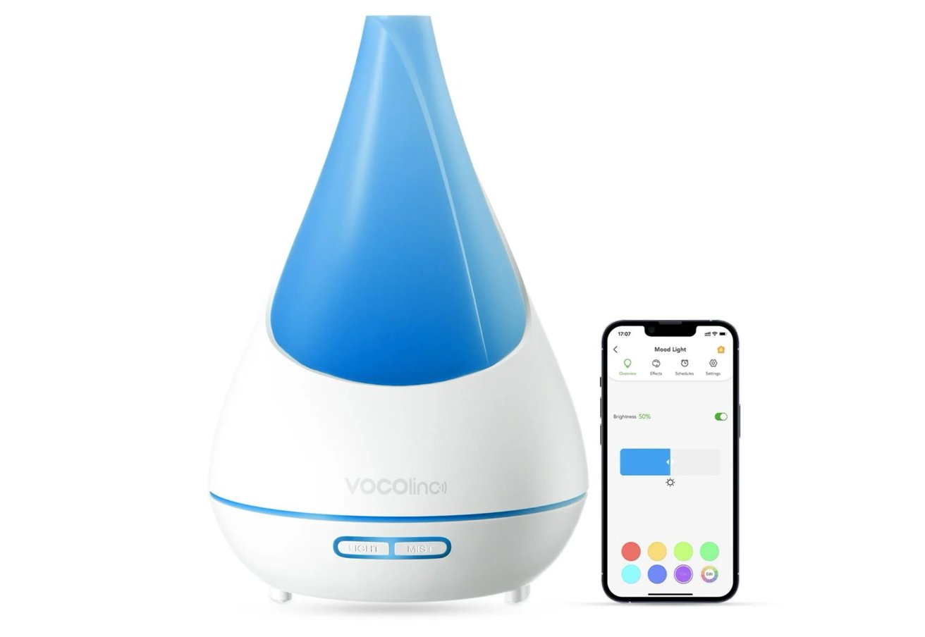 A teardrop-shaped smart diffuser with a blue top and branded base, next to a smartphone displaying a control app.