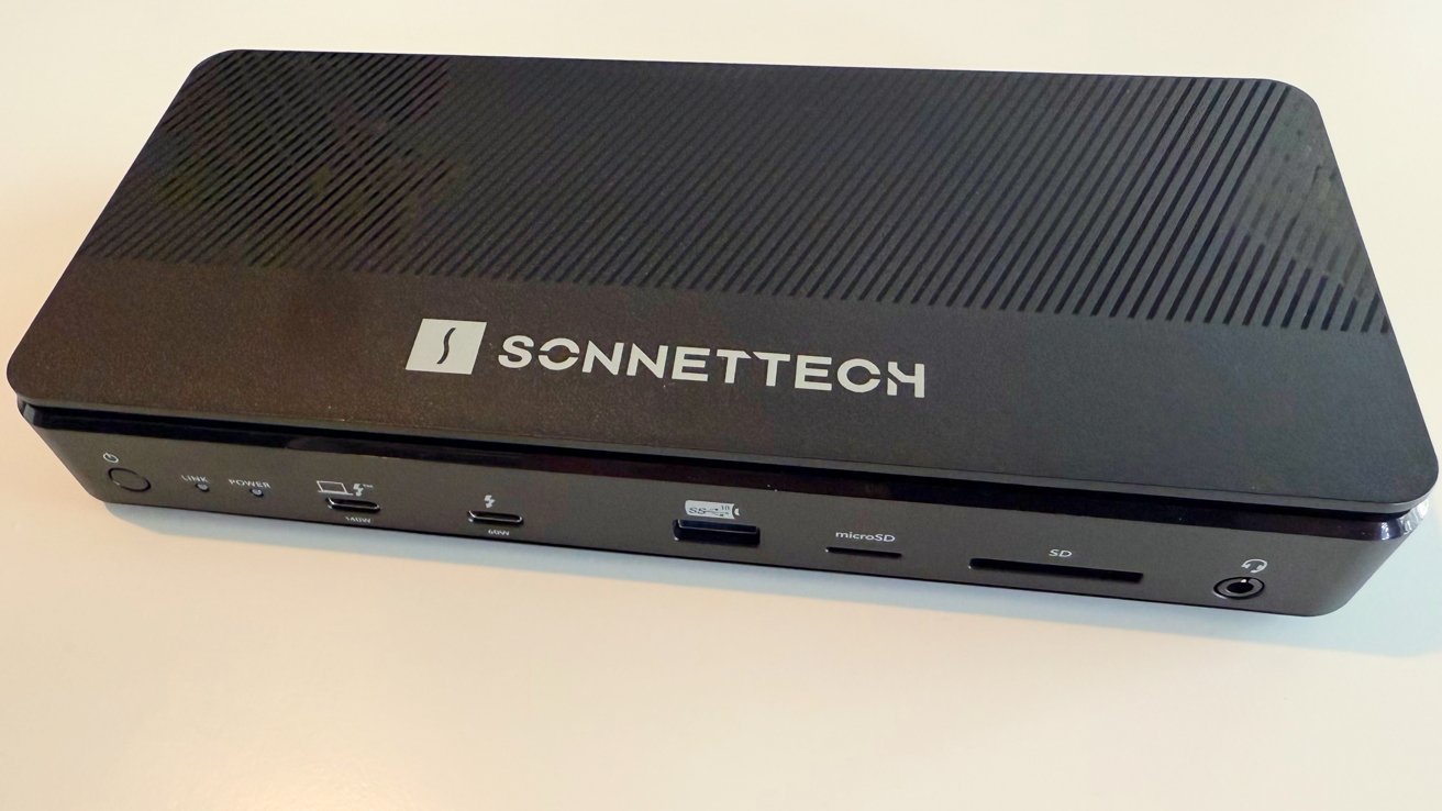 Black SonnetTech docking station with multiple ports including USB, HDMI, microSD, and SD card slots, featuring a sleek, grooved top design.