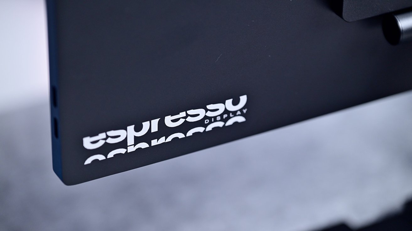 Close-up of a black monitor with the words espresso Display in white, partially visible.