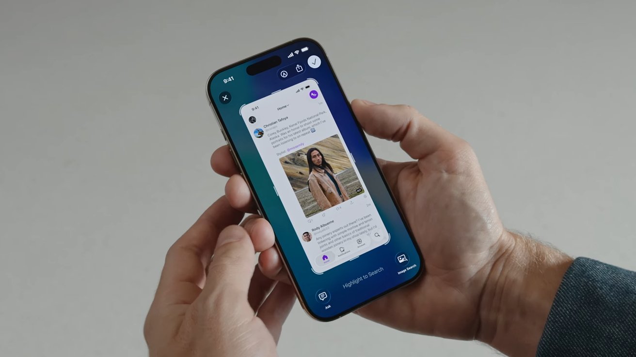 Person holding a smartphone displaying a social media feed, featuring a photo of someone outdoors, with app icons and text visible on screen.