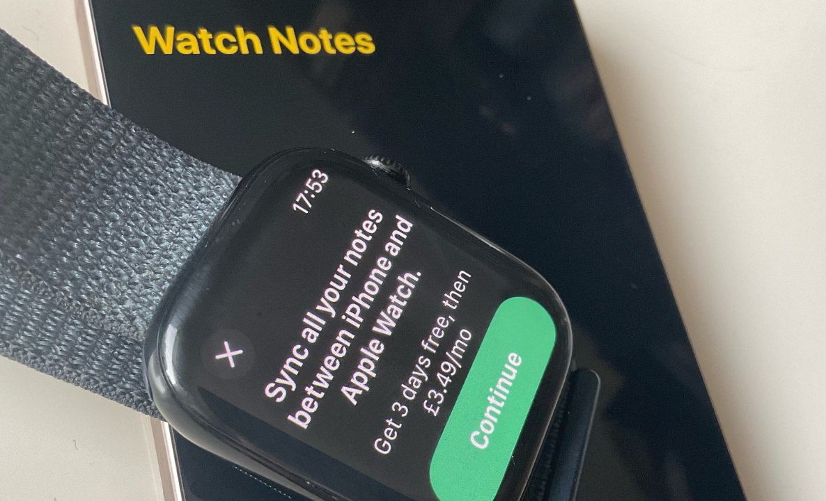 Smartwatch displaying prompt to sync notes between iPhone and Apple Watch for a monthly fee, with 'Watch Notes' on a smartphone in the background.
