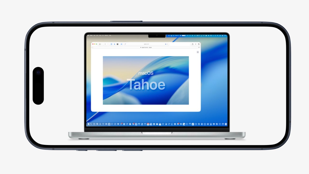 Smartphone displaying a laptop screen with macOS Tahoe wallpaper. Bright blue and white abstract design visible.