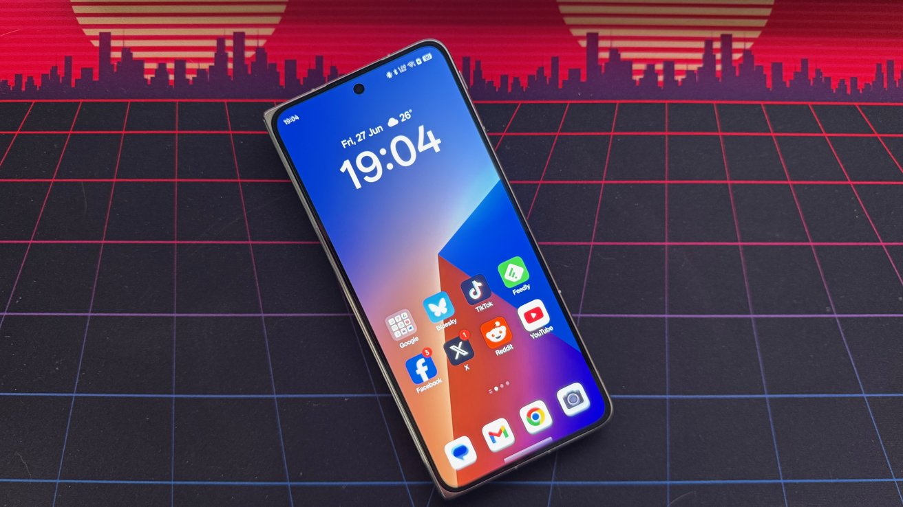 Smartphone displaying apps on a colorful background with a retro city skyline and sun design.
