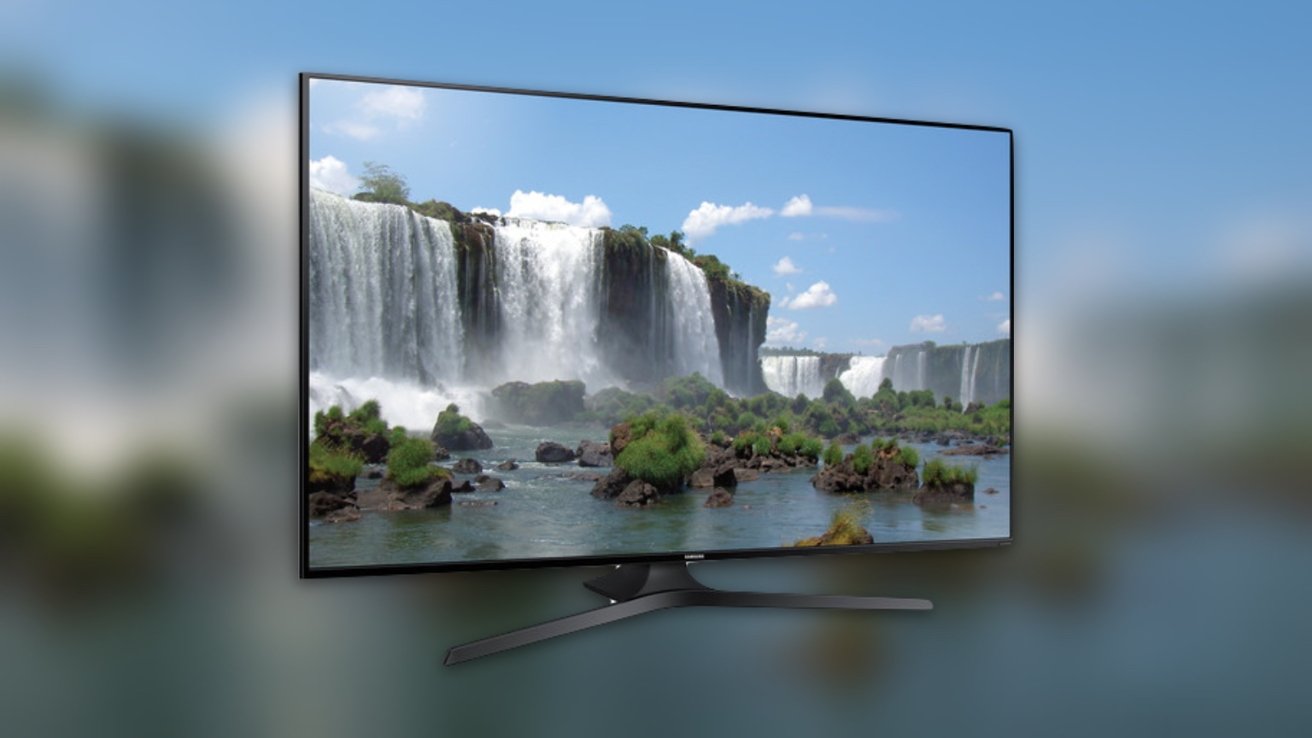 A flat-screen TV displays a vivid waterfall scene with lush greenery and clear blue sky, blending into the background with a soft-focused effect.