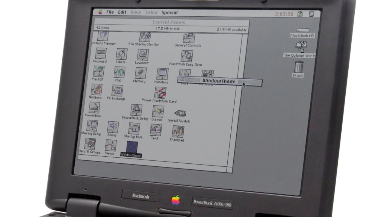 A vintage Macintosh PowerBook displaying a classic Mac OS interface with control panels, application icons, and a highlighted 'WindowShade' option.