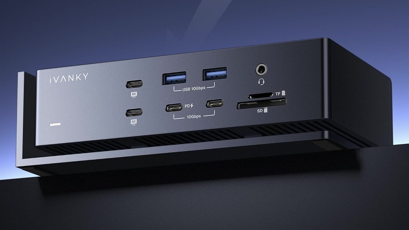 Black rectangular device with multiple ports including USB, HDMI, audio jack, and card slots, labeled with specifications like 6K and 10Gbps.