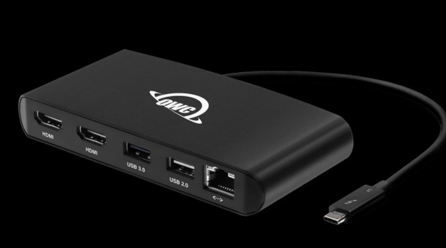 Black electronic hub with multiple ports including two HDMI, USB 3.0, USB 2.0, Ethernet, and a connected USB-C cable, featuring the OWC logo.
