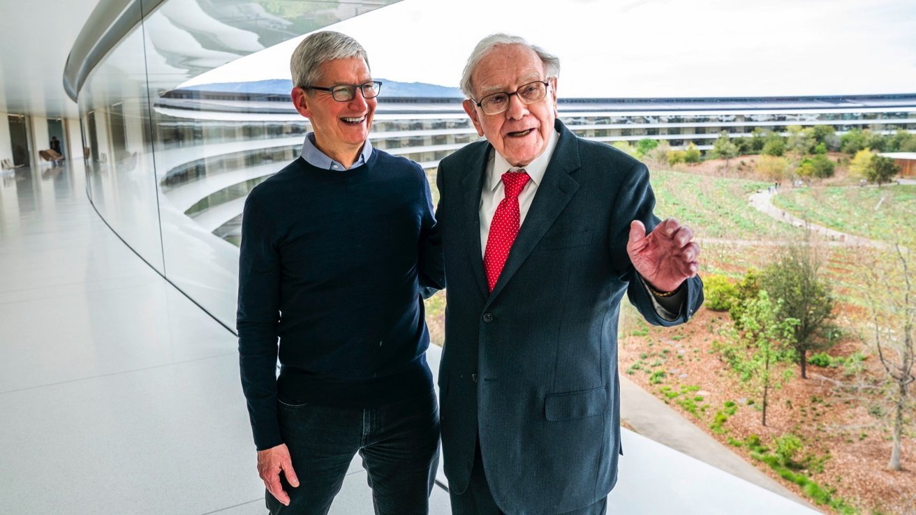 Two men smiling and conversing inside a modern glass-walled building, with a lush garden and futuristic architecture visible outside.