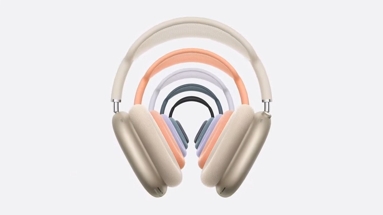 Nine pairs of stylish over-ear headphones in different colors, aligned concentrically, creating a tunnel-like effect.