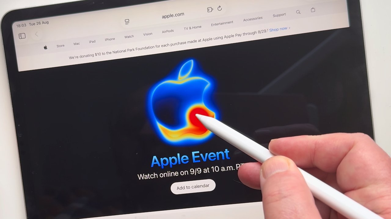 A hand holding a stylus points to a colorful Apple logo on a tablet screen displaying Apple Event details.