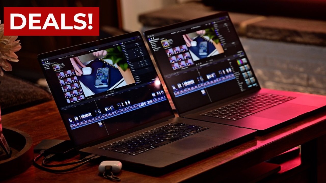 Two MacBook Pro laptops on a table displaying video editing software, surrounded by accessories, with a 'Deals!' sign on the top left.