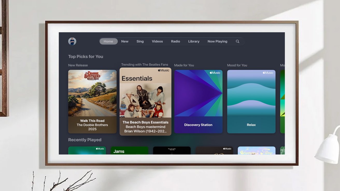 Digital music interface on screen displaying albums and playlists, including 'Walk This Road' by The Doobie Brothers, and The Beach Boys Essentials. Categories include Top Picks and Recently Played.