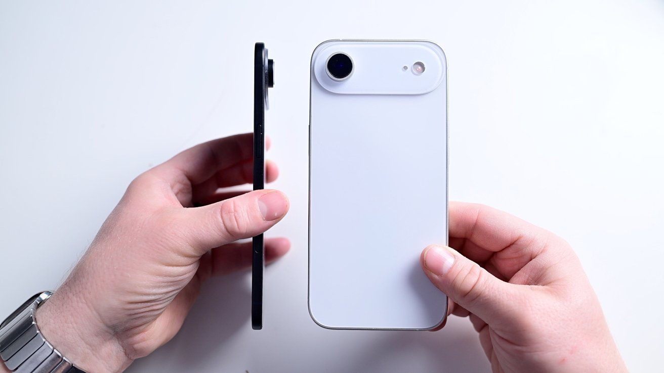 Two hands holding smartphones; one shows the back with a camera, the other displays the side profile.