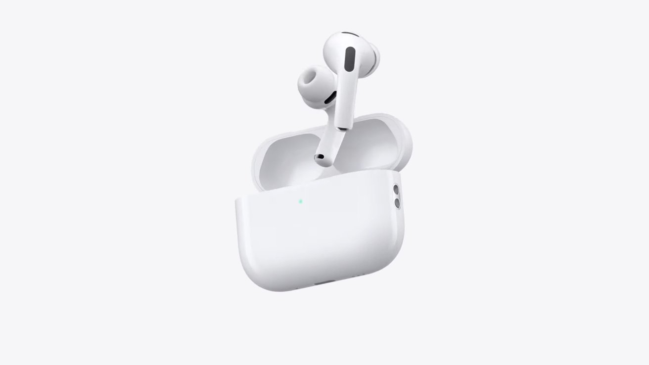 White wireless earbuds in an open charging case against a plain white background.