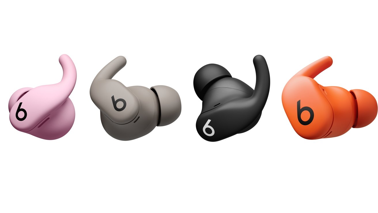 Four wireless earbuds in pink, beige, black, and orange, each with a wingtip and a lowercase 'b' logo.