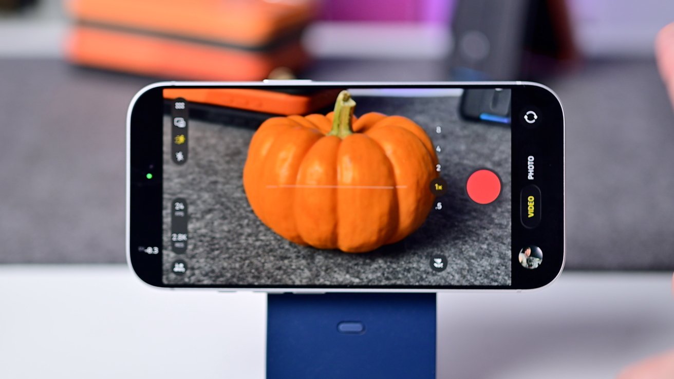 A phone in video mode showing a pumpkin