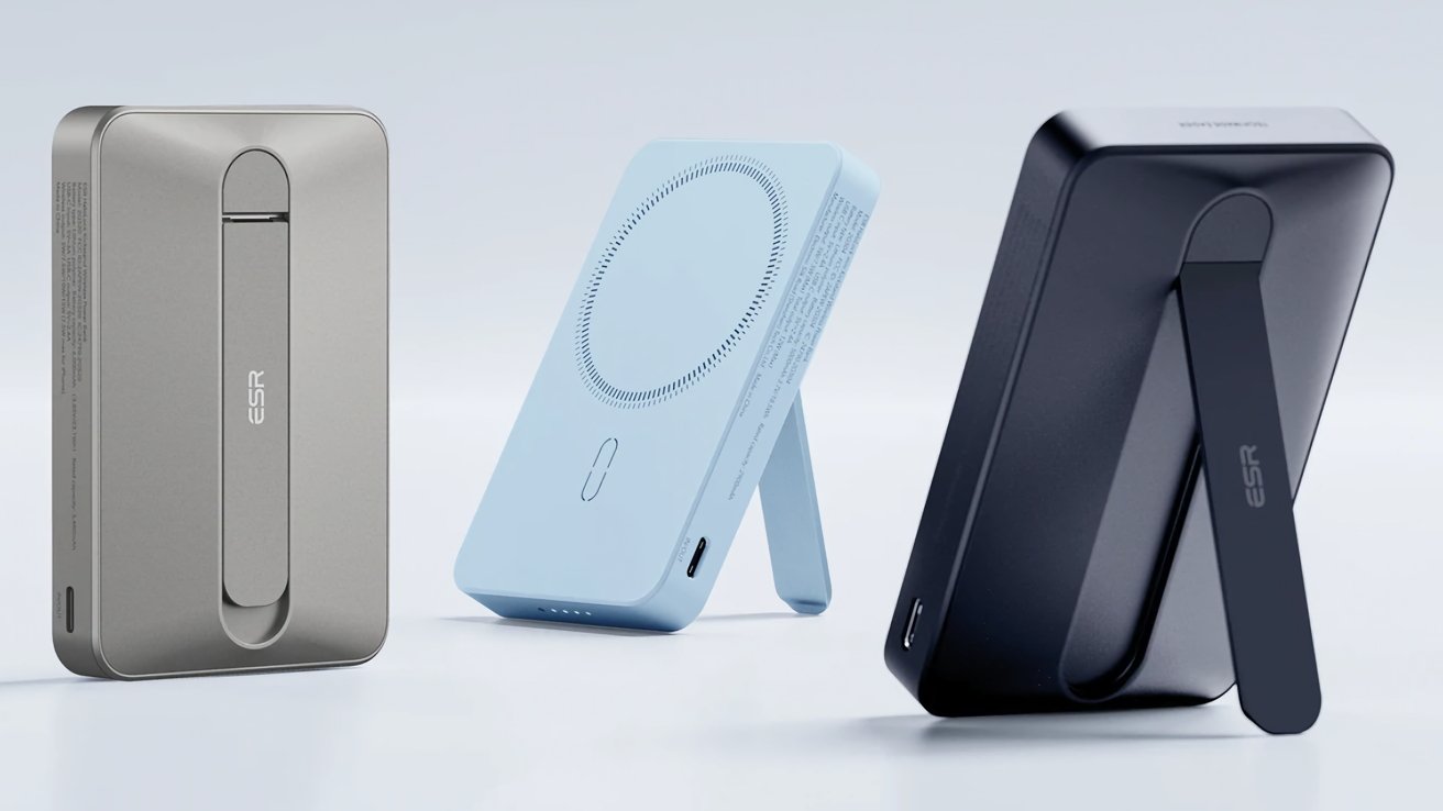 Three portable chargers with built-in kickstands in gray, light blue, and black, standing upright on a light background.