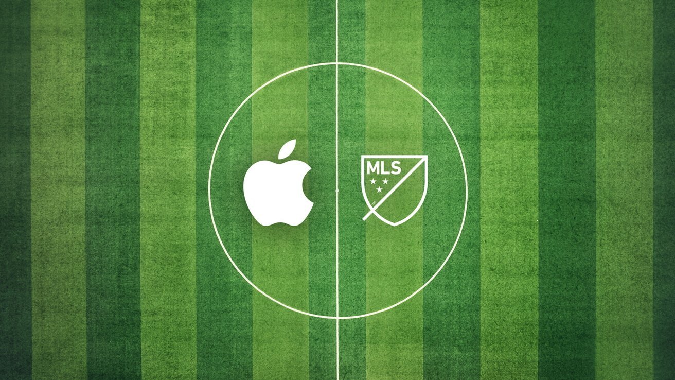 Soccer field with white Apple and MLS logos centered on green grass, surrounded by the center circle.
