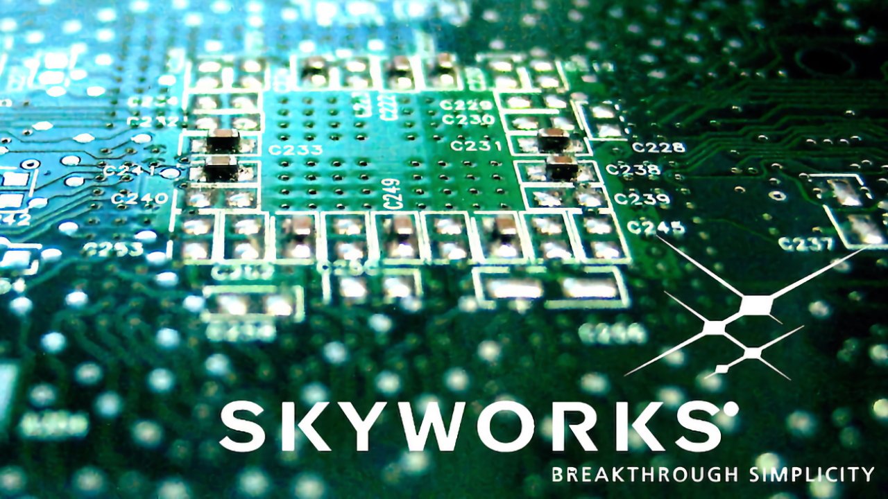 Close-up view of a green circuit board featuring electronic components with the text 'SKYWORKS' and 'BREAKTHROUGH SIMPLICITY' at the bottom.