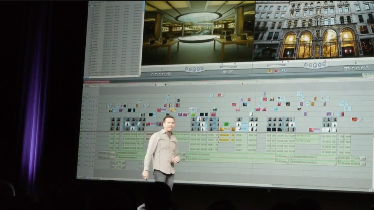 Person presenting in front of a large screen displaying a video editing timeline with various clips and images arranged in sequence.