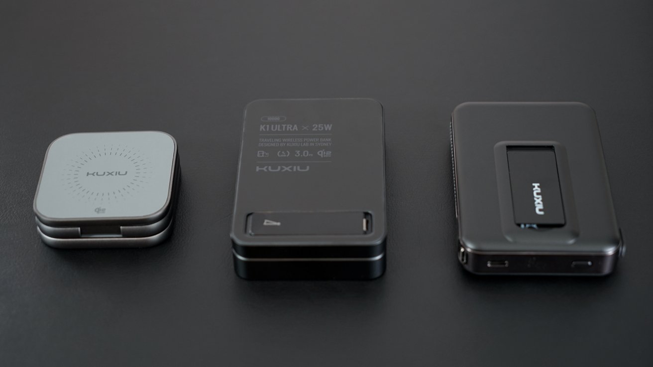 Three portable electronic devices on a dark surface. Left: square, compact. Center: rectangular, labeled 25W. Right: larger, rectangular with buttons on side.