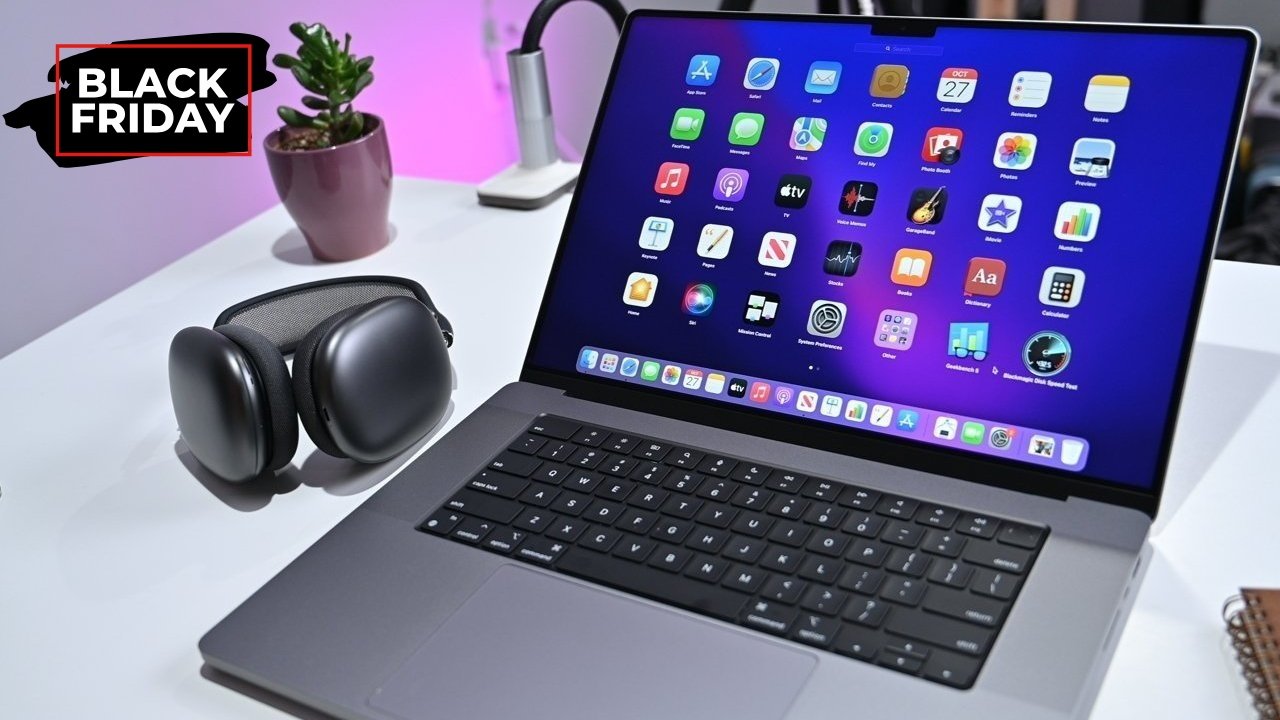 MacBook Pro with app icons on screen, AirPods Max beside it on a desk, potted plant in background, and 'Black Friday' text.