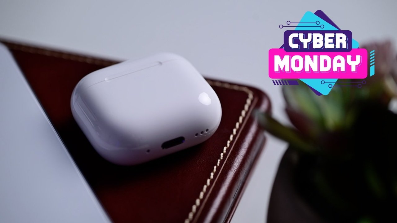 AirPods in case on brown leather surface, next to a Cyber Monday sale graphic with vibrant colors.