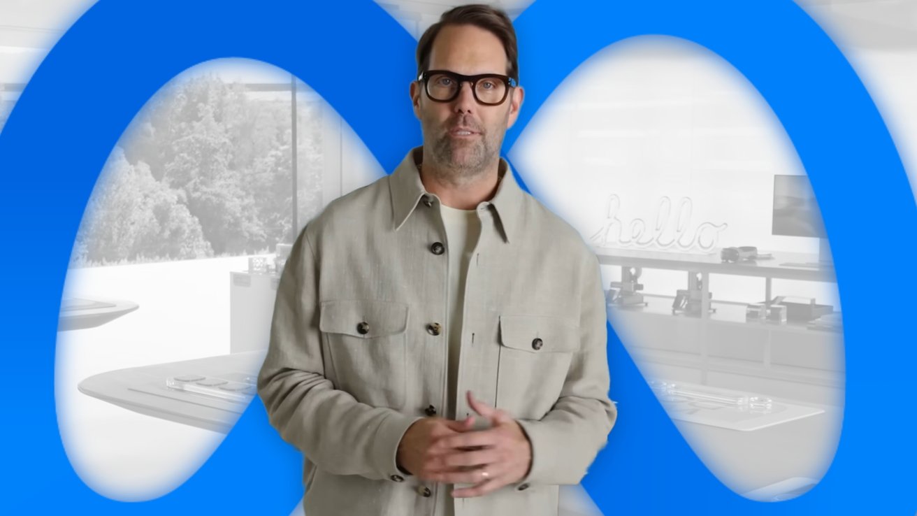 A person wearing glasses and a beige jacket stands in front of a large blue Meta logo, with a modern office background.