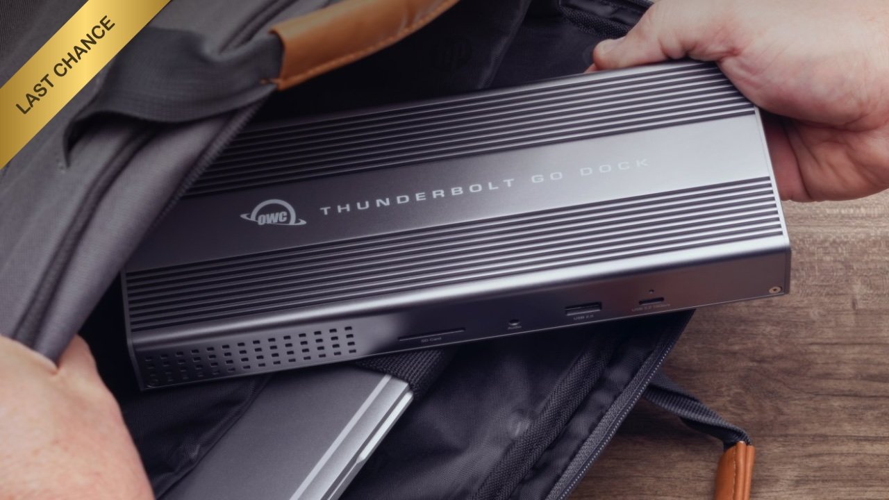 Person placing a silver OWC Thunderbolt Go Dock into an open backpack, wooden surface beneath, and a 'Last Chance' banner in the top left corner.
