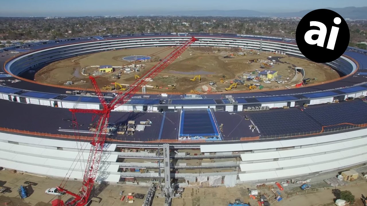 Aerial view of a large circular construction site with a red crane, solar panels, and surrounding structures amidst greenery and mountains in the background.