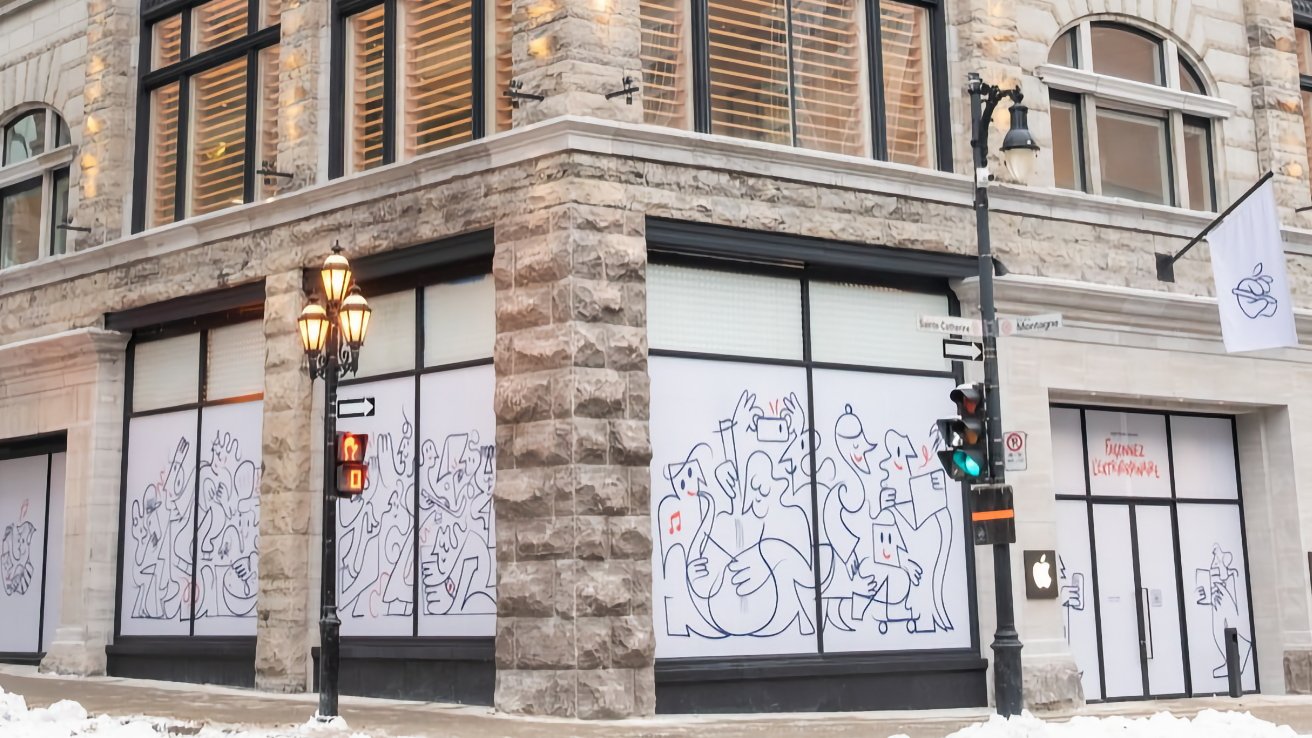 Street corner of a stone building with large windows covered in whimsical line drawings. A lamppost and traffic light are visible. Snow partially covers the sidewalk.