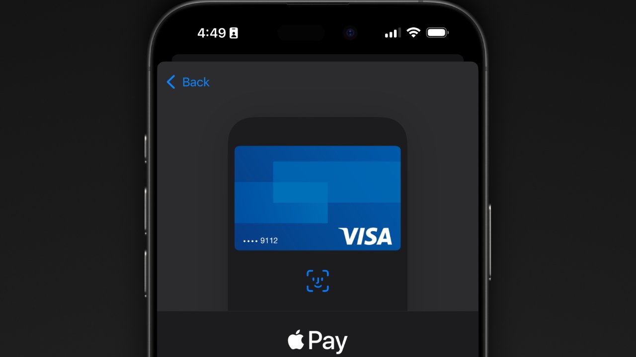 iPhone screen showing Apple Pay with a blue Visa card centered, partial card number 9112 visible, on a dark background with time and status icons at the top