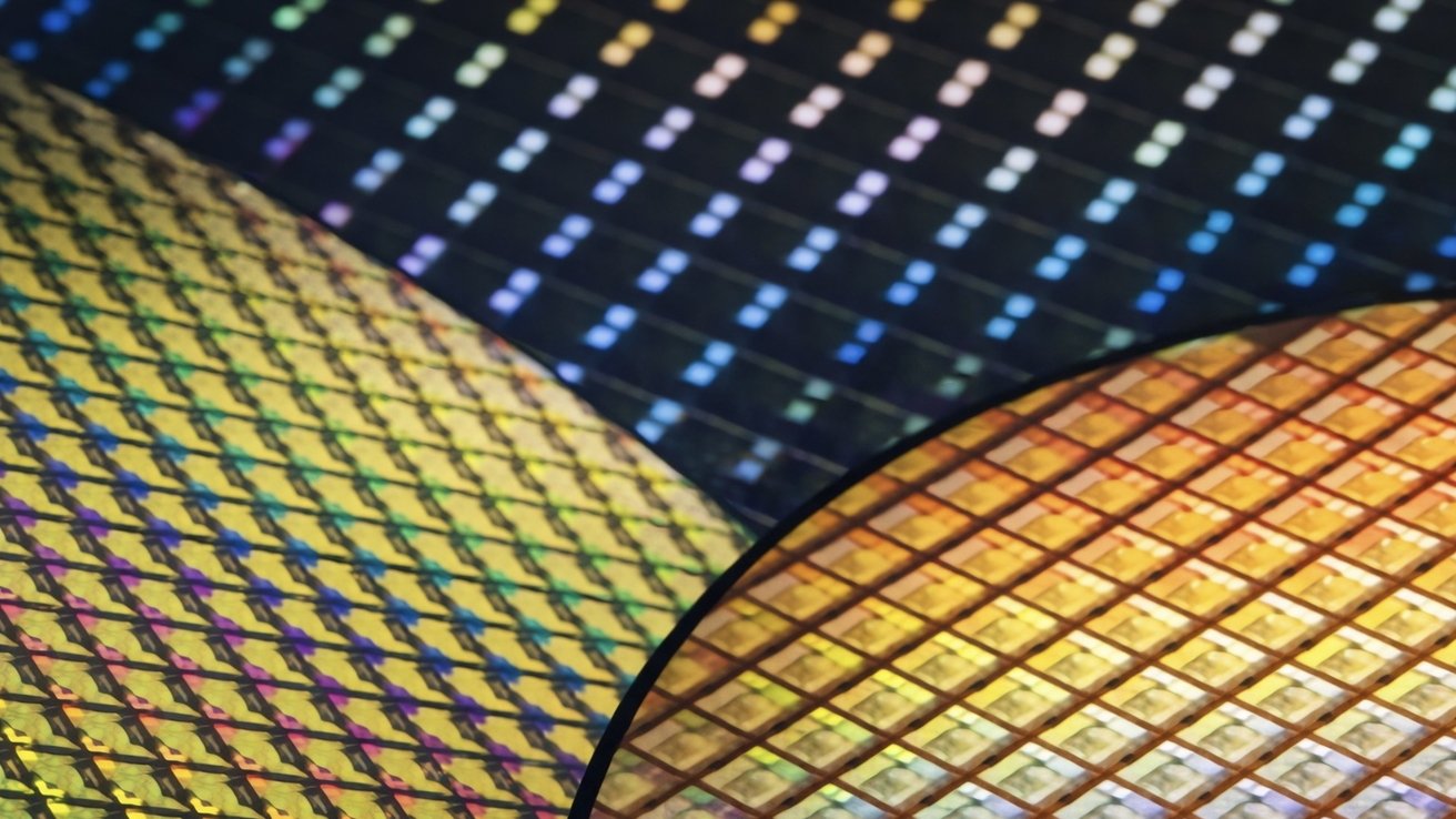 Close-up of overlapping silicon wafers covered in tiny, colorful square patterns, reflecting rainbow light and illustrating intricate semiconductor microchip circuits