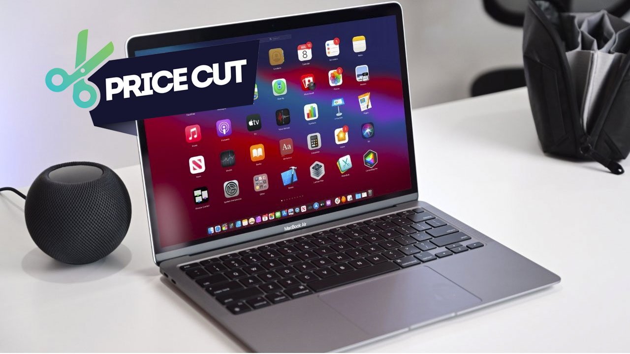 M1 MacBook Air on a desk showing colorful app icons, with a black spherical smart speaker beside it and a price cut graphic with scissors over the screen