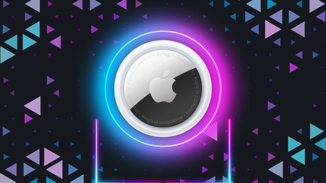 Apple AirTag centered against a dark background, surrounded by glowing blue and pink neon rings, with colorful triangular patterns scattered around like confetti.