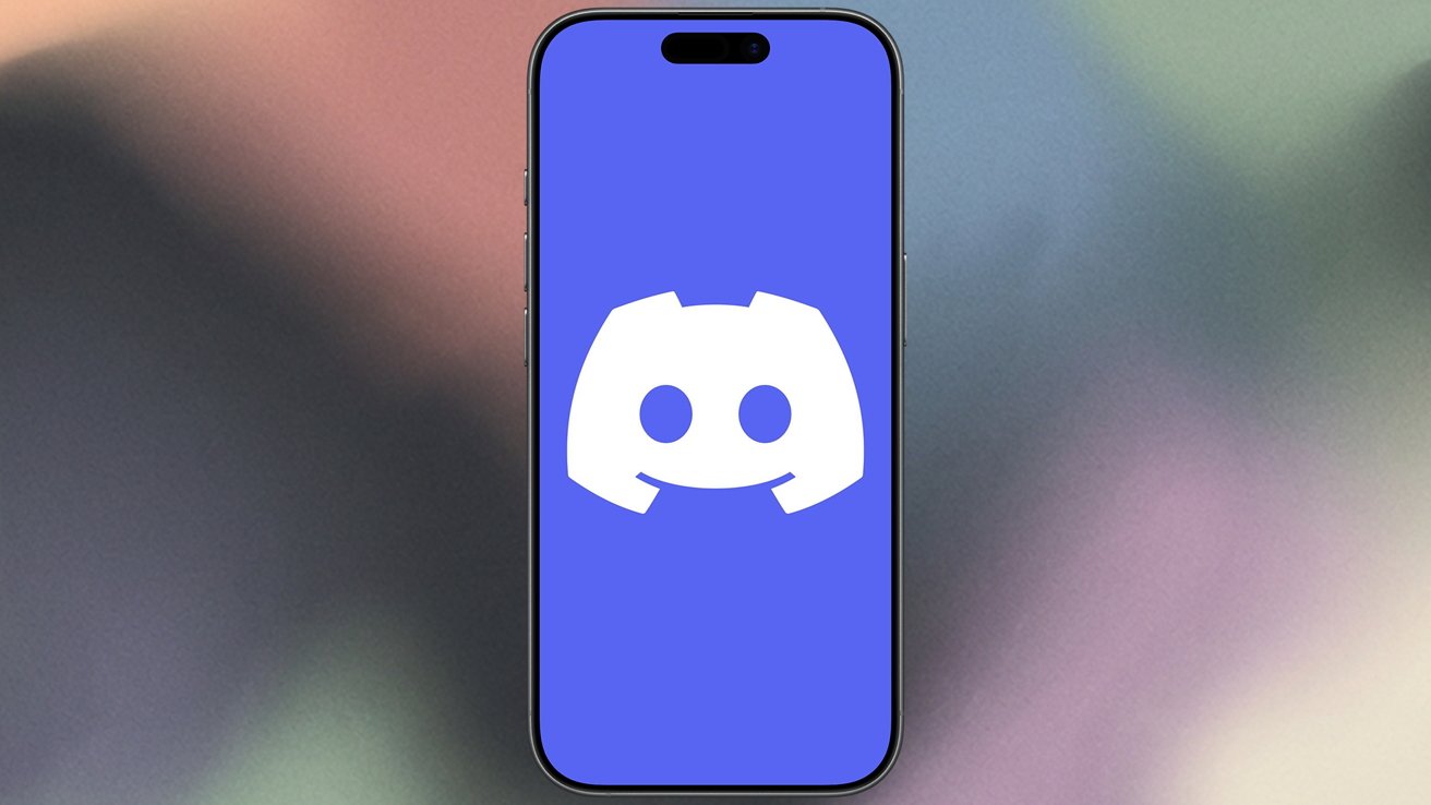 Smartphone displaying the white Discord logo on a bright blue screen, centered against a soft, blurred gradient background of muted pink, green, and blue colors
