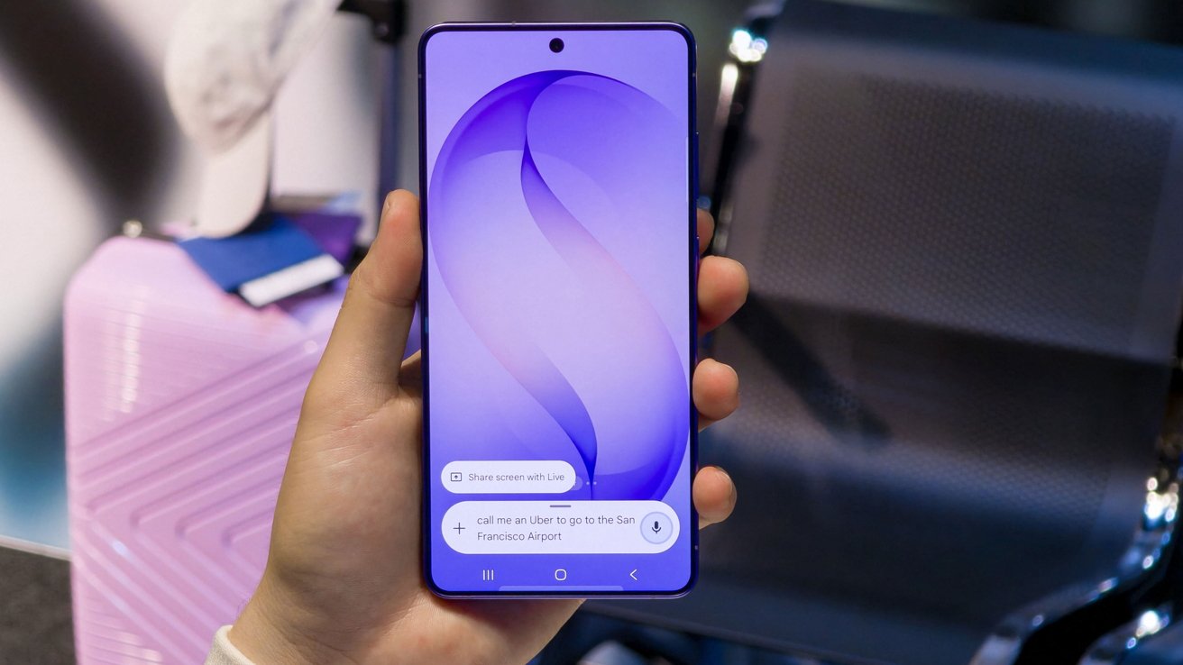Hand holding a blue smartphone with a purple abstract wallpaper, showing a voice command asking for an Uber to San Francisco Airport, against blurred luggage and seating in the background