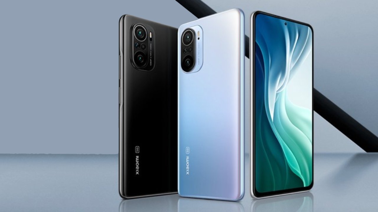 Three smartphones in black and silver with triple rear cameras, displayed against a gray background.