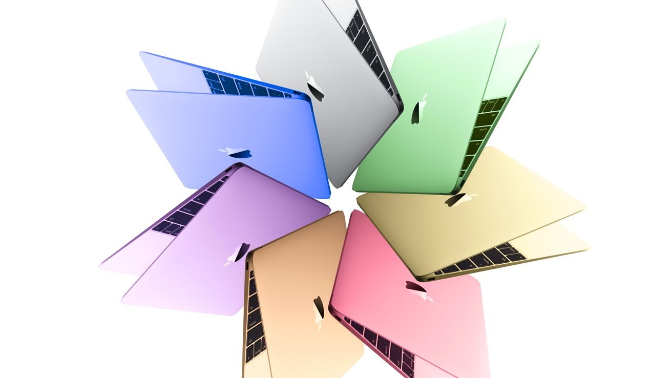 Six colorful Apple laptops arranged in a circular fan, partially open, showing keyboards and glowing logos in pastel shades of blue, green, yellow, pink, peach, and purple on white background
