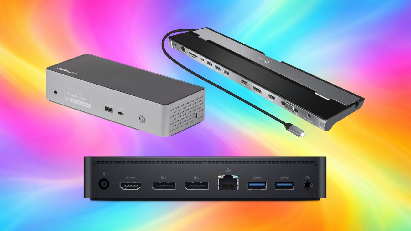 Three computer docking stations with multiple ports and cables arranged on a bright, multicolor gradient background of swirling pink, blue, yellow, orange, and green tones