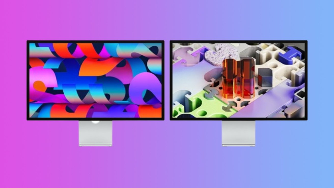 Two sleek desktop monitors side by side on a pinktoblue gradient background, each displaying colorful abstract digital artwork with vivid shapes and 3D forms